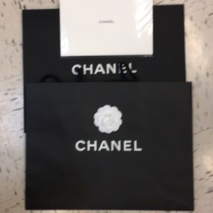 2 shopping bags and  dust bag